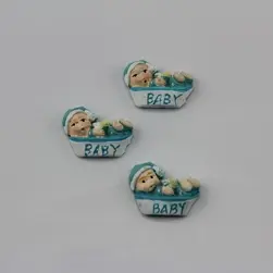 Stick On Polyresin Baby in Crib Pkt 12 Blue